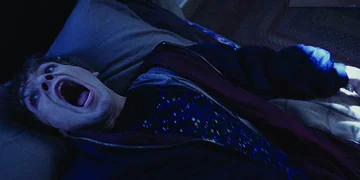 Bug Lay On A Bed Terrified With His Mouth Wide Oped