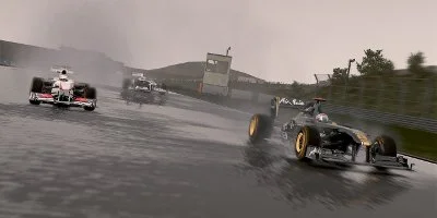 A Lotus, Sauber, and Williams, racing in the rain