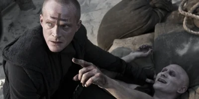 Priest Holding A Vampire Down Who Is Pointing Upwards