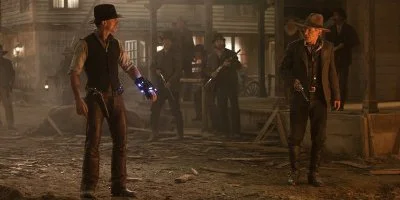 Two Cowboys Stood Looking At Each Other