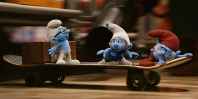 Papa Smurf, Brainy And Gutsy On A Skateboard With A Box